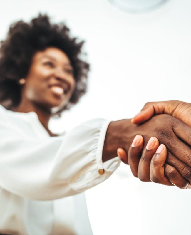 Business handshake for teamwork of business merger and acquisition,successful negotiate,hand shake,two businessman shake hand with partner to celebration partnership and business deal concept